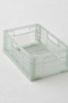 a small plastic container sitting on top of a white surface