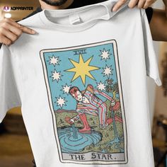 a man holding up a tarot card t - shirt