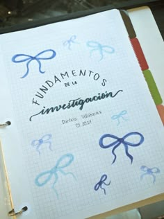 a notebook with scissors drawn on it and writing underneath the words fundamientos de la innigacion