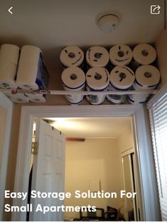 several rolls of toilet paper are stacked on top of each other above the door way