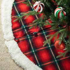 a christmas tree skirt with candy canes on it