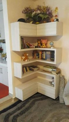 a corner book shelf in the corner of a bedroom