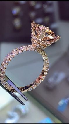 a fancy diamond ring on display in a store