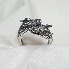 Double Dragon Carved Mens Ring Material : 925 Silver Ring Size : 8 adjustable Weight : +/- 7g (Random Weight) Silver Dragon Jewelry, Collectible Dragon Design Ring, Adjustable Dragon Design Jewelry Ring, Sterling Silver Ring With Dragon Design For Gift, Sterling Silver Dragon Design Ring, Double Dragon, Dragon Ring, Carved Ring, White Dragon