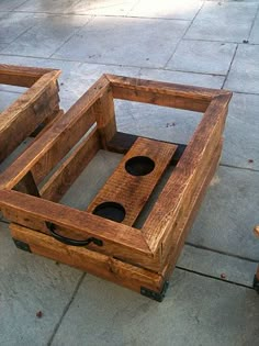 two wooden crates sitting on top of a sidewalk