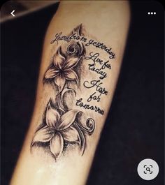 a woman's arm with flowers on it and the words, i love you