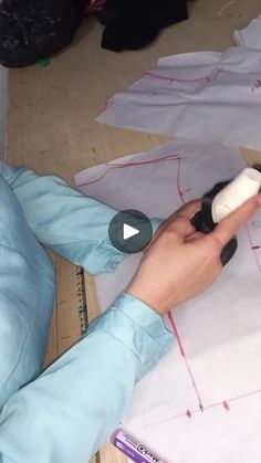 a person is cutting fabric with scissors