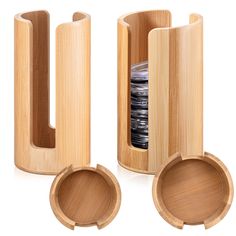 two wooden containers with lids are stacked on top of each other and one is filled with plates