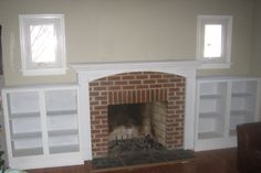 a living room with a fire place and bookshelves