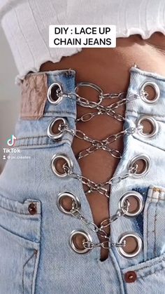 the back of a woman's jeans with chains on it