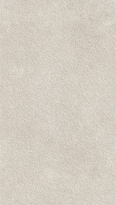 an image of a white textured wallpaper with no pattern on the bottom half