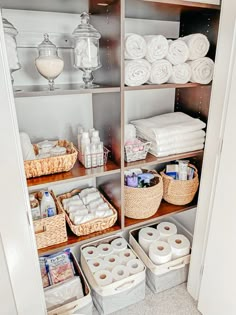 the closet is filled with lots of toilet paper and other bathroom items, including rolls of toilet paper