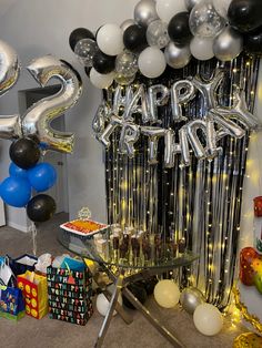 a party room with balloons, streamers and presents