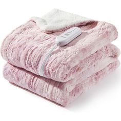 two pink blankets stacked on top of each other with a thermometer attached to them