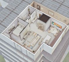 an aerial view of a floor plan with furniture and living room in the top level