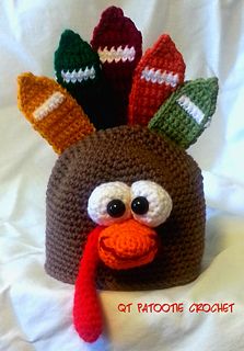 a crocheted turkey hat with footballs on it's head and eyes