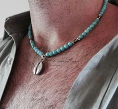 Before placing an order please check the estimated shipping times. If you need your order in a hurry shipping upgrades are available.  Thank you. Mens turquoise necklace D E T A I L S *This design features  6mm turquoise howlite stones separated by grooved spacer beads and barrel shaped hematite beads. (Hematite is a type of iron oxide) *and a cowrie shell. *Choose between an antique silver metal one or a natural (real)cowrie shell. Metal cowrie measures 19mm and the natural shells between 18 an Mens Surfer Style, Mens Beaded Necklaces, Turquoise Beaded Necklace, Cowrie Shell Necklace, 20 Inch Necklace, Necklace Mens, Surfer Style, Turquoise Jewelry Native American, Small Necklace