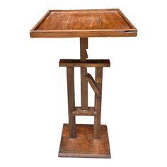 an old wooden table with a square top