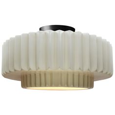 a large white light fixture with a black metal base and round glass shade on the ceiling