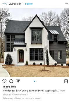 a white house with black roof and windows