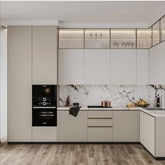 a kitchen with white cabinets and marble counter tops, along with wooden flooring that matches the walls