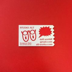 a sticker on the side of a red wall that says studio art 909