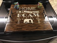 a wooden sign that says home is where you roam