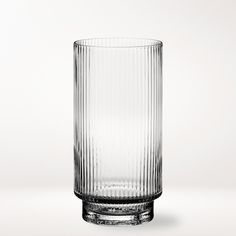 an empty glass sitting on top of a table