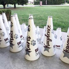 there are many white cones with dog paw designs on them and the words sparkle written on them