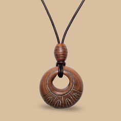 Introducing the "Tayanita" Hardwood & Leather Boho Necklace - a captivating blend of artisanal craftsmanship and timeless style. This unique piece seamlessly combines the rich textures of hardwood and genuine leather to create a stunning accessory inspired by tribal influences. Dimensions: wood pendant : 6 x 6 x 2 cm. natural dark brown leather cord: 3mm Designed for versatility, the "Tayanita" necklace effortlessly transitions from chic to casual, making it the perfect choice for any dressed-up Boho Aesthetic, Wooden Pendant, Wood Pendant, Dark Brown Leather, Rich Textures, Boho Necklace, Leather Cord, Vintage Charms, Pendant Necklaces