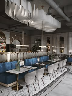 the interior of a restaurant with blue and white booths