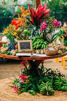 an arrangement of flowers and plants on a table