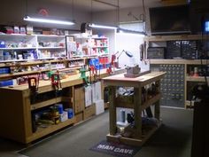 a room filled with lots of different items and shelves full of bottles on top of them