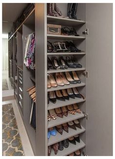 an organized closet with lots of shoes