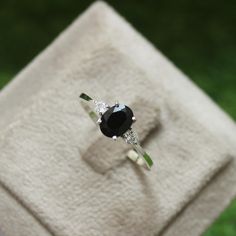 * Material: 925 Sterling Silver * DETAILS ✥ Handmade Ring ✥ - Center Stone: Natural Black Onyx - Center Stone Size: 6X8 MM - Center Stone Shape: Oval - Side Stone: CZ diamond  - Band Color: Silver Shiny ✥ O T H E R ∙ I N F O R M A T I ON ✥ ♦ Your item will be nicely packed to gift in elegant jewelry boxes. ♦ Custom Order We can make custom rings in almost any shape and style. If you want a specific model, please send us a clear picture and we will do our best. ♦ Delivery All Item will be Shipped within 3 to 5 Days after payment receive. The delivery time usually takes 11 to 23 days, depending which Country & location. ♦ Payment we accept payment through PayPal only, Payment should be made within 3 days of purchase. ♦ Ring Size Visit your local jeweller to be sized, (Most offer this service Fine Jewelry Onyx Silver Ring, Unique Silver Onyx Rings, Silver Oval Onyx Jewelry, Black Onyx Diamond Ring For Gift, Adjustable Silver Onyx Ring, Wedding Ring For Women, Ring Birthstone, Black Onyx Ring, Onyx Ring