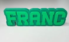 the word franc spelled in green plastic letters