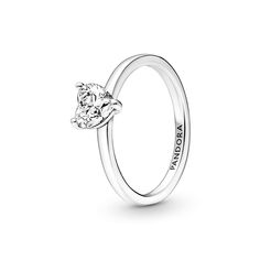 The latest addition to our solitaire collection, the Sparkling Heart Solitaire Ring features a heart-shaped clear cubic zirconia as the centerpiece. The Pandora logo is engraved on the inside of the polished shank. Stack this ring with other sterling silver pieces for a monochromatic look or mix metal finishes to make a unique statement. Classic White Gold Heart Ring With Solitaire, Classic Solitaire Heart Ring In White Gold, Classic Solitaire Heart Ring With Cubic Zirconia, Classic Sterling Silver Heart Ring With Brilliant Cut, Pandora Stackable Rings, Heart Solitaire Ring, Chanel Wallpaper, Pandora Logo, Pandora Ring