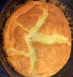 a close up of a bread in a pan on a stove top with melted cheese