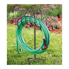 a garden hose holder in the grass