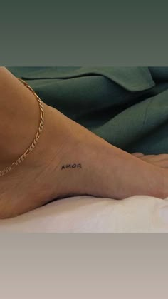 a woman's foot with the word armor written on it