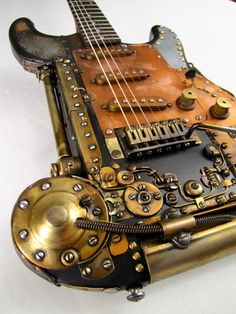 an old steampunk guitar is sitting on the table