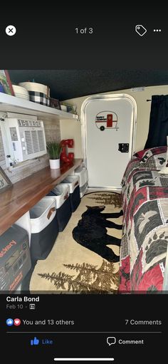 the interior of a camper trailer with its bed pulled up to it's side