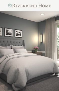 a bedroom with gray walls and white bedding