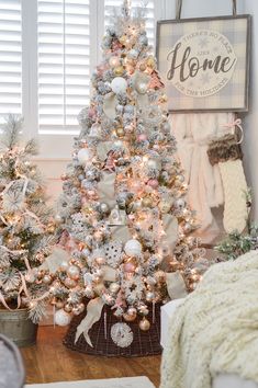 three christmas trees are decorated with white and silver ornaments