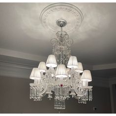 a chandelier hanging from the ceiling in a room