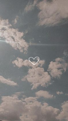 a heart shaped object floating in the sky