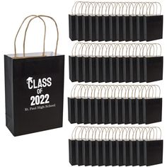 black paper bags with white handles are shown in front of the bag that says class of 2012