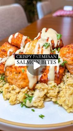 crispy parmesan salmon bites on top of pasta with white sauce and garnish