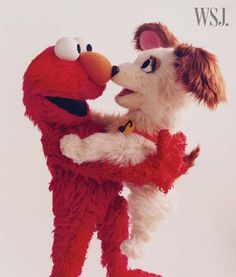 two stuffed animals are hugging each other in front of a white background with the words wsj on it