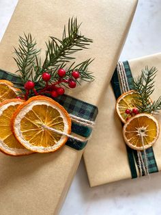 two wrapped presents with orange slices on them